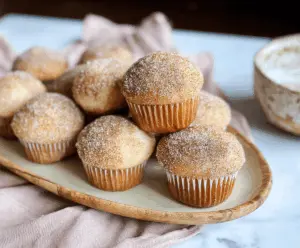 Delicious cinnamon sugar donut muffins topped with cinnamon sugar coating, perfect for breakfast or snacks.