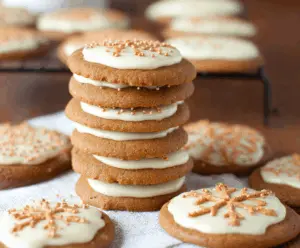 Eggnog Iced Gingerbread Cookies with festive icing and gingerbread spices on a holiday plate.