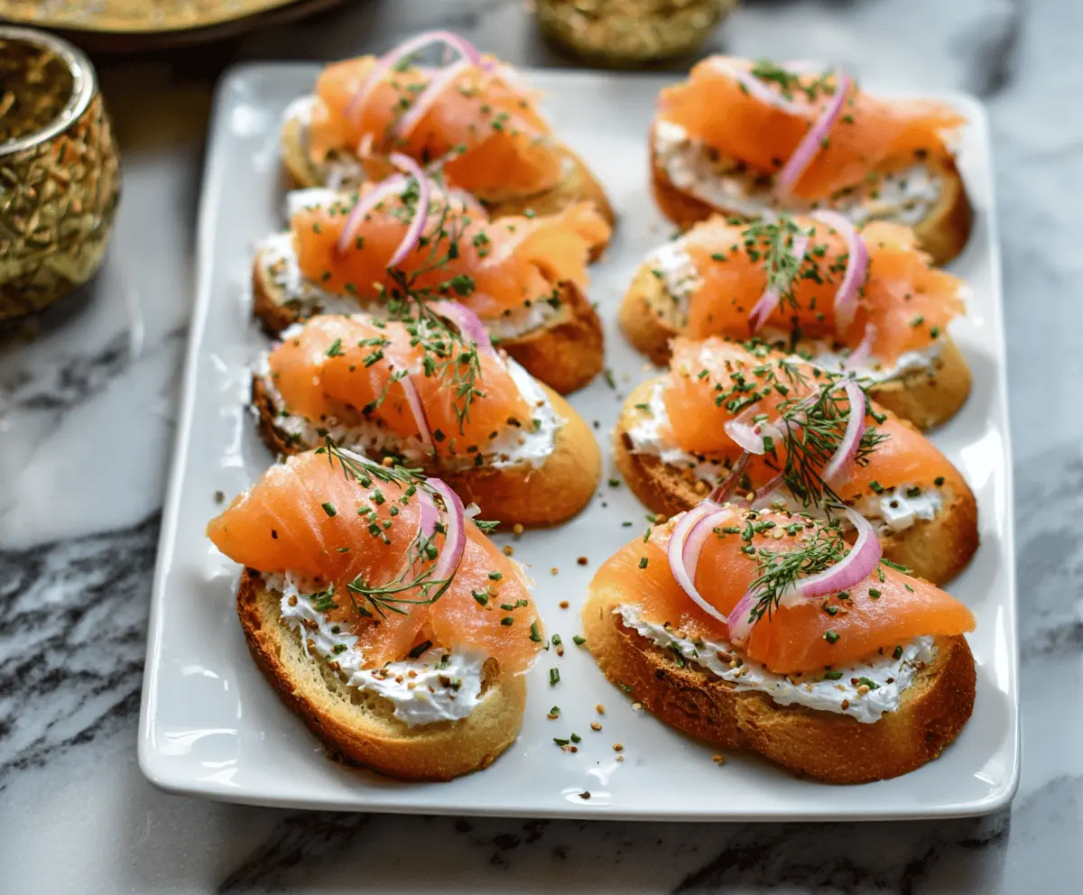 Delicious smoked salmon crostini garnished with fresh herbs on a rustic platter.