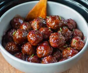 Delicious crockpot grape jelly meatballs served in a bowl, perfect for parties and gatherings.