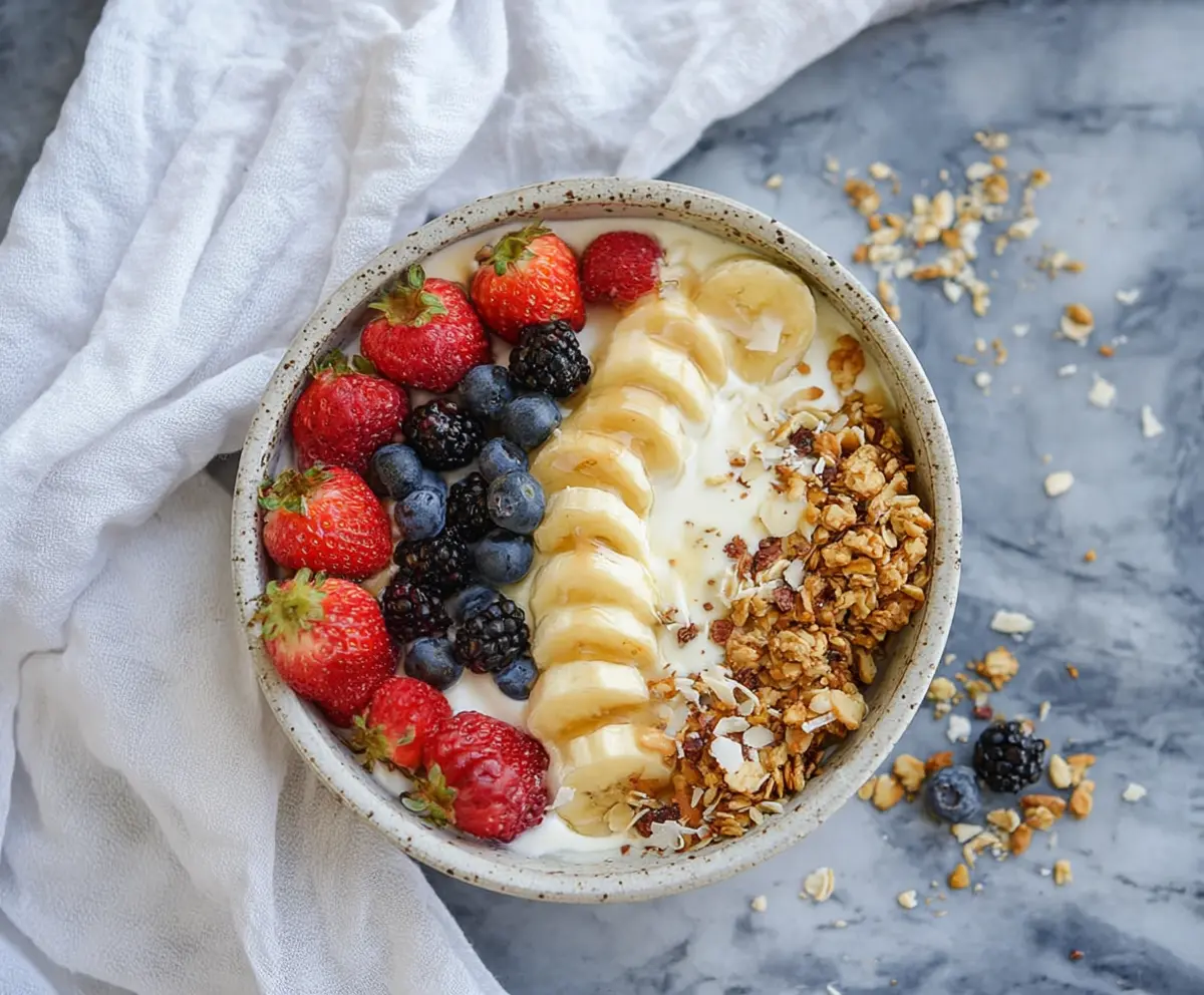 Healthy Greek Yogurt Protein Bowl topped with fresh fruits and nuts for a nutritious breakfast.