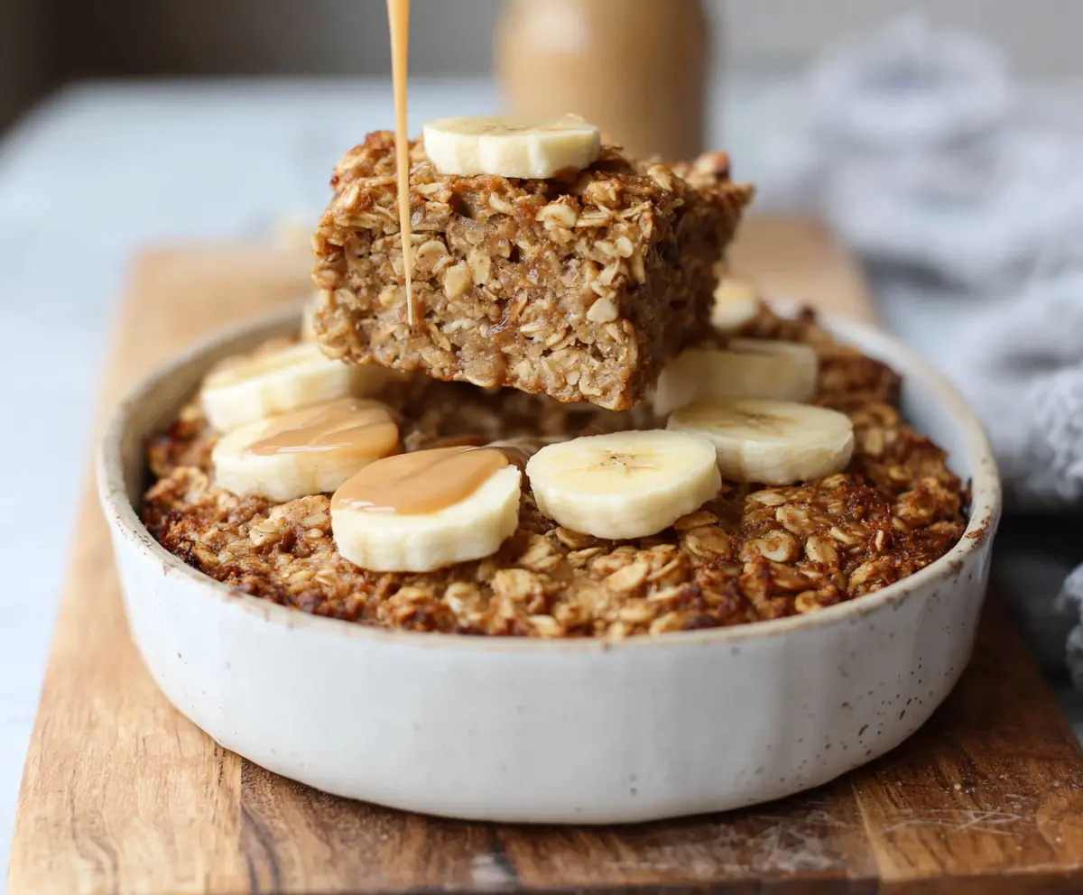 Delicious Banana Bread Baked Oatmeal served in a bowl, showcasing its golden crust and moist texture.