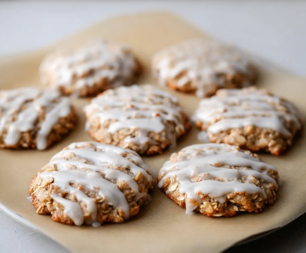 Delicious sourdough discard glazed oatmeal cookies on a plate, ready to serve.