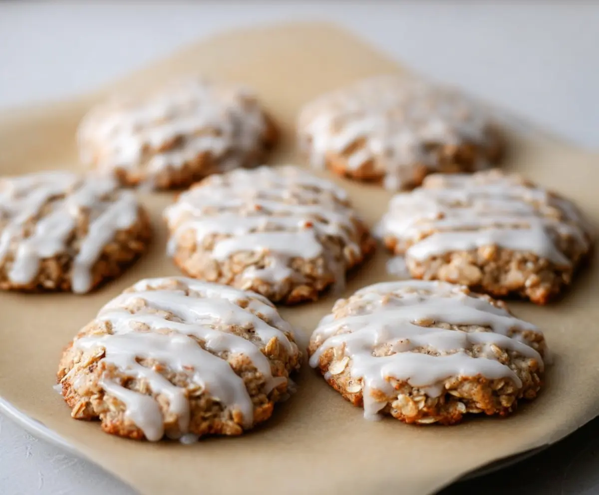 Delicious sourdough discard glazed oatmeal cookies on a plate, ready to serve.
