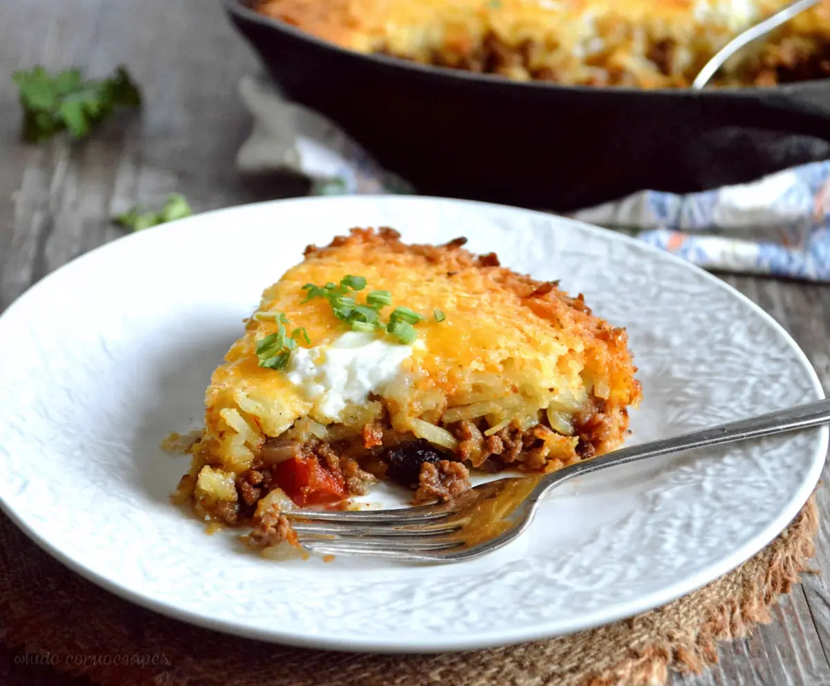 Delicious Hash Brown Shepherd's Pie topped with crispy hash browns and hearty beef filling.