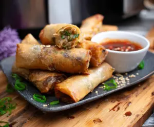 Crispy Air Fryer Spring Rolls with fresh vegetables and dipping sauce.