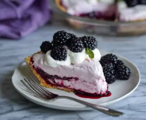 Delicious Blackberry Ice Cream Pie with fresh blackberries and creamy ice cream in a crispy crust