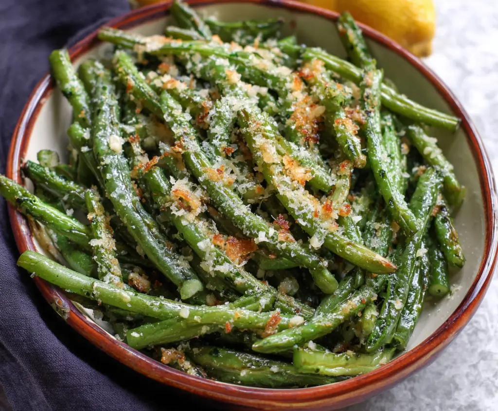 Fresh Garlic Parmesan Green Beans, a delicious side dish with green beans topped with garlic and melted Parmesan cheese.
